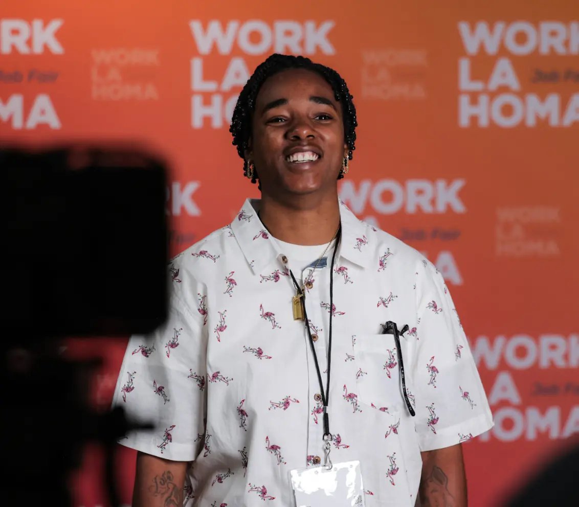 WORKlahoma attendee at event backdrop