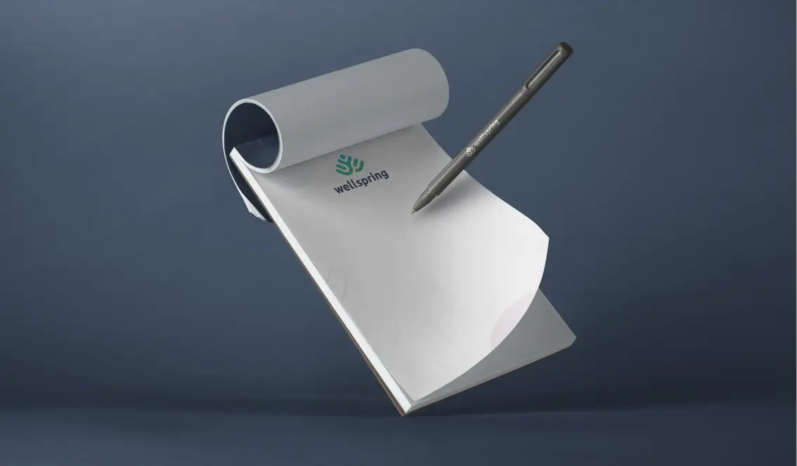 Wellspring branded notepad and pen
